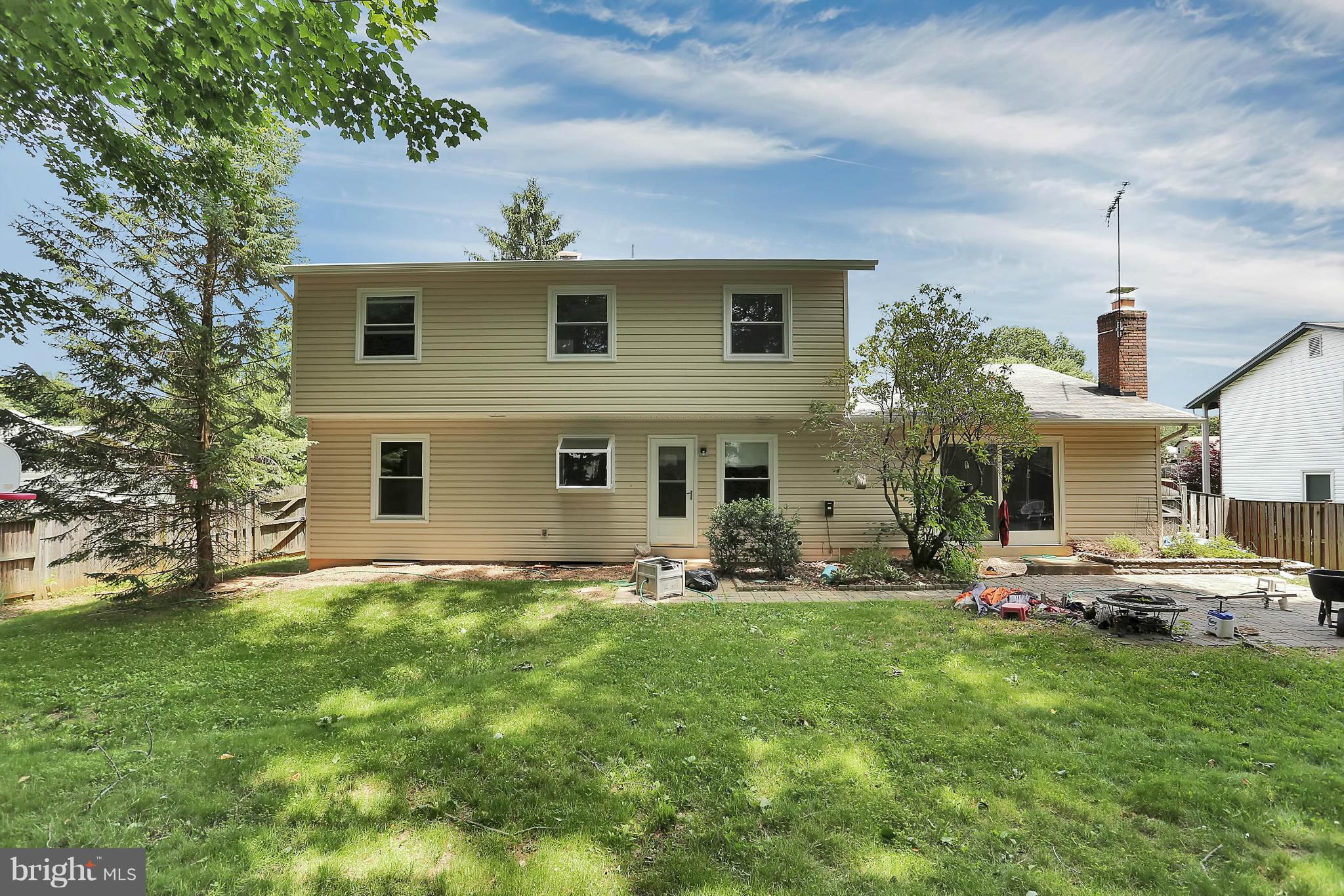 9160 Rockefeller Lane Springfield, VA 22153 - Photo 24 of 27 a front view of house with yard and seating area