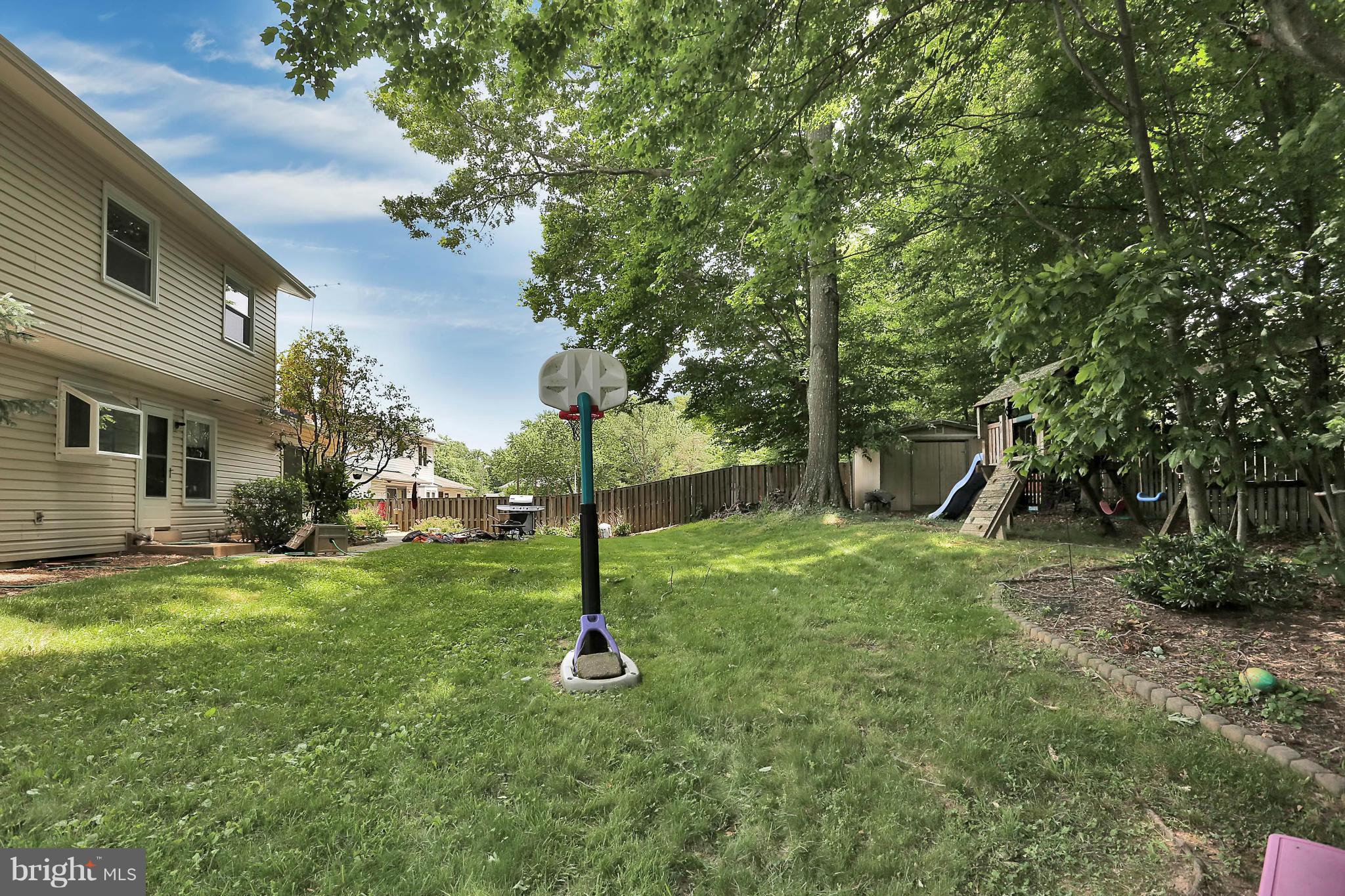 9160 Rockefeller Lane Springfield, VA 22153 - Photo 26 of 27 a backyard of a house with entertaining space