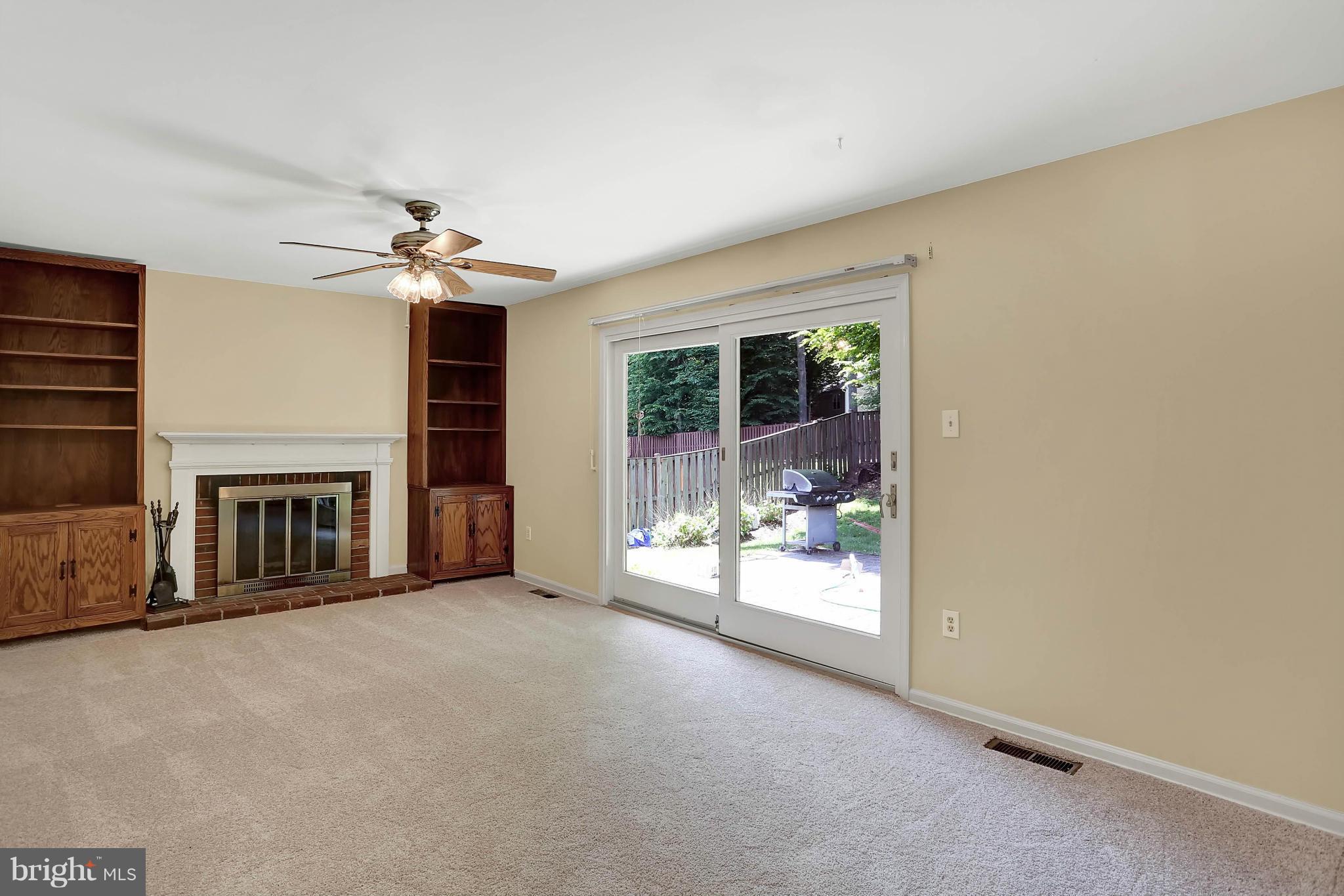 9160 Rockefeller Lane Springfield, VA 22153 - Photo 5 of 27 a view of a livingroom with a fireplace and window