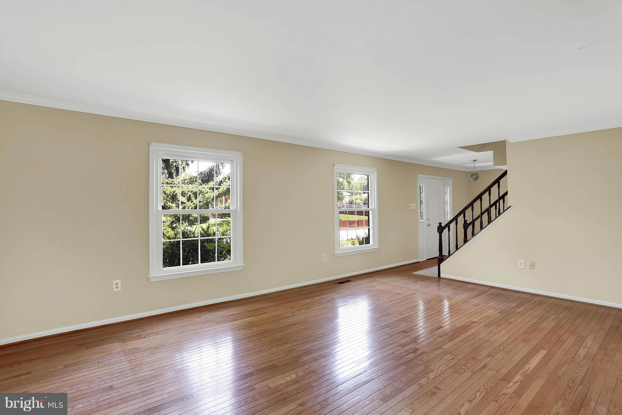 9160 Rockefeller Lane Springfield, VA 22153 - Photo 7 of 27 a view of an empty room with wooden floor and a window