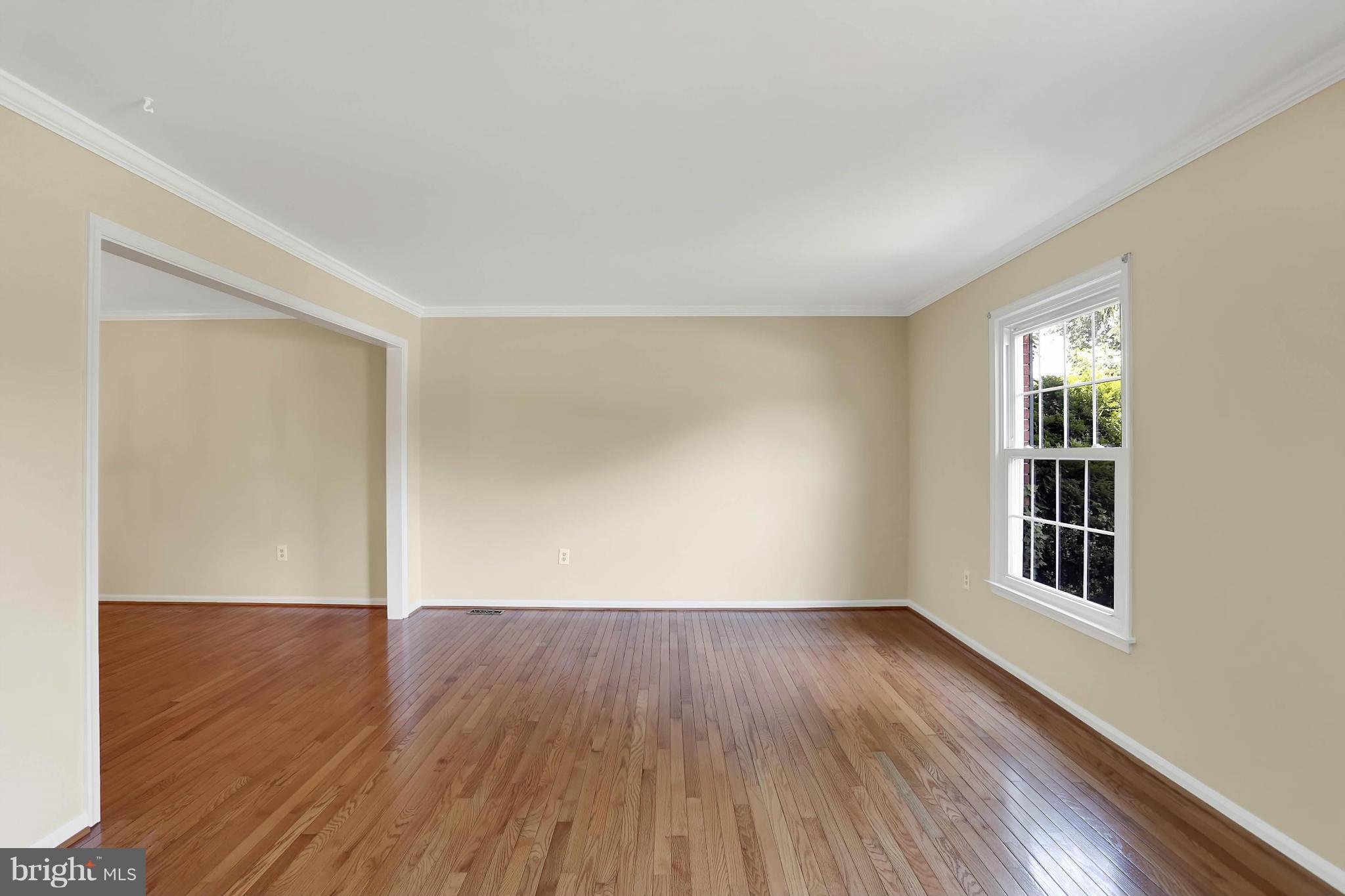 9160 Rockefeller Lane Springfield, VA 22153 - Photo 8 of 27 an empty room with wooden floor and windows