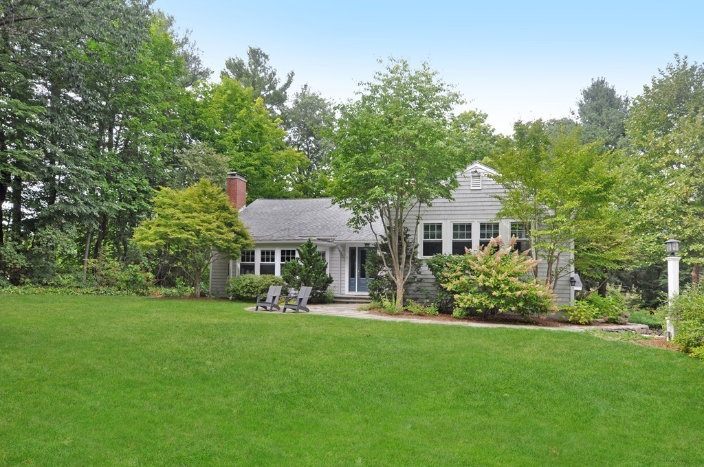 32 Martin Road Concord, MA 01742 - Photo 1 of 17 a front view of a house with a garden and trees