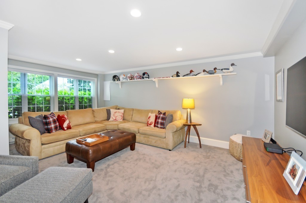 32 Martin Road Concord, MA 01742 - Photo 13 of 17 a living room with furniture and a flat screen tv
