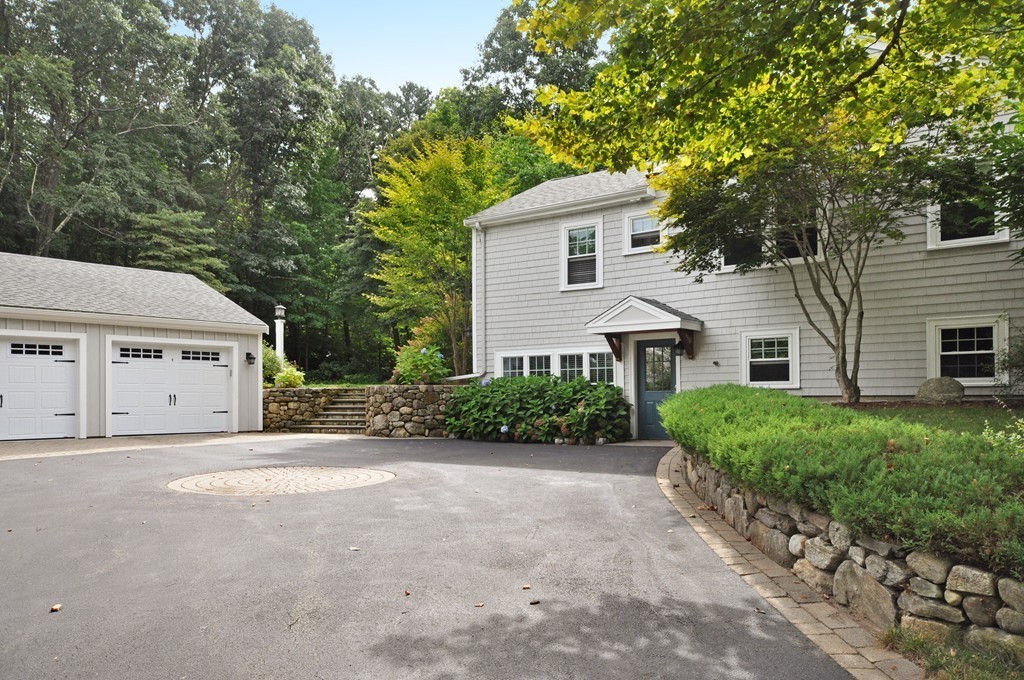 32 Martin Road Concord, MA 01742 - Photo 16 of 17 a view of a house with a yard and garage