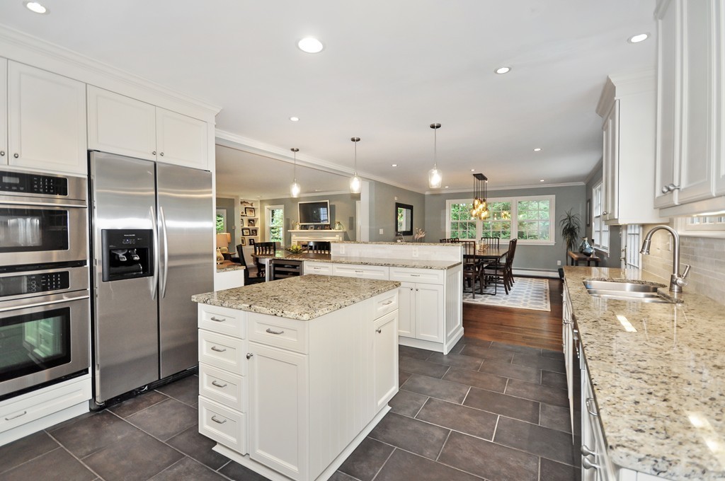 32 Martin Road Concord, MA 01742 - Photo 3 of 17 a kitchen with a sink stainless steel appliances and cabinets