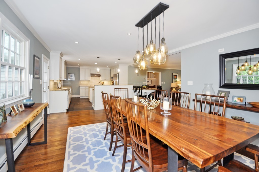 32 Martin Road Concord, MA 01742 - Photo 4 of 17 a dining room with furniture a chandelier and wooden floor