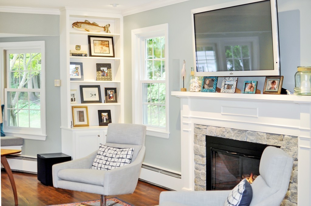 32 Martin Road Concord, MA 01742 - Photo 7 of 17 a living room with furniture and a fireplace