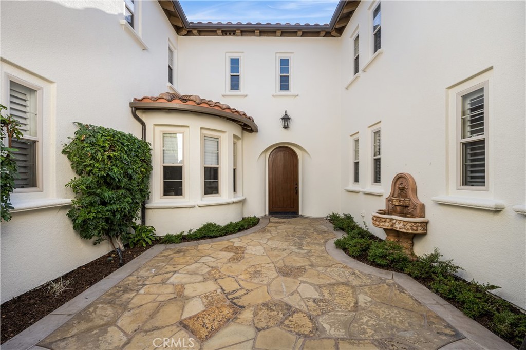 10875 Turnleaf Lane Tustin, CA 92782 - Photo 5 of 15 a front view of a house with a yard