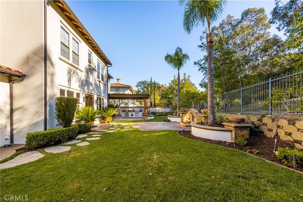10875 Turnleaf Lane Tustin, CA 92782 - Photo 8 of 15 a view of a house with backyard and sitting area