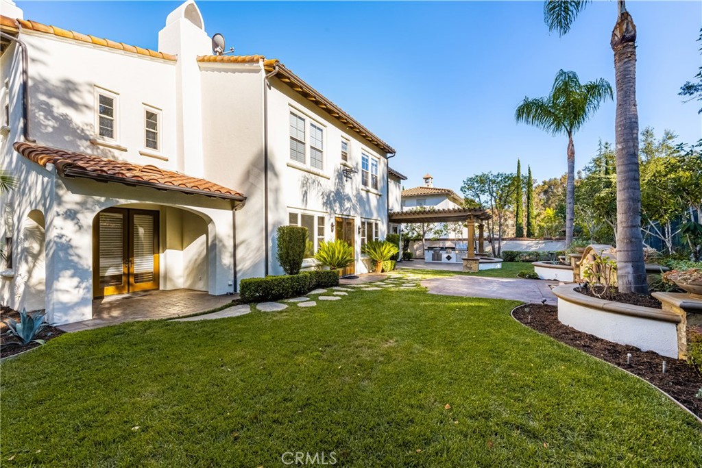 10875 Turnleaf Lane Tustin, CA 92782 - Photo 9 of 15 a view of a house with a swimming pool and a chairs