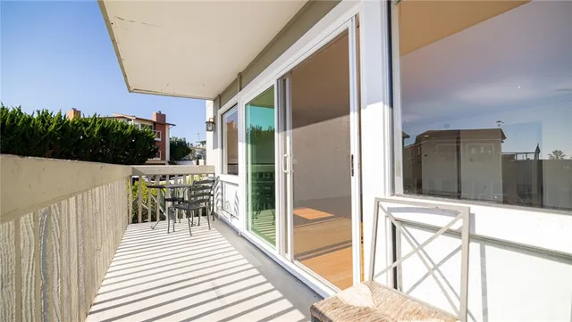 a view of a livingroom with a fireplace and wooden floor