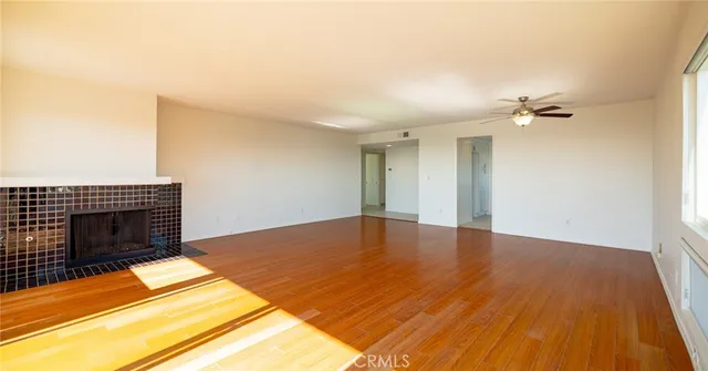 a bathroom with a granite countertop sink a toilet and a mirror
