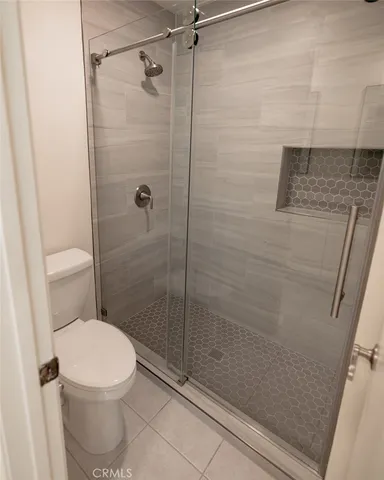 a bathroom with a shower and a sink