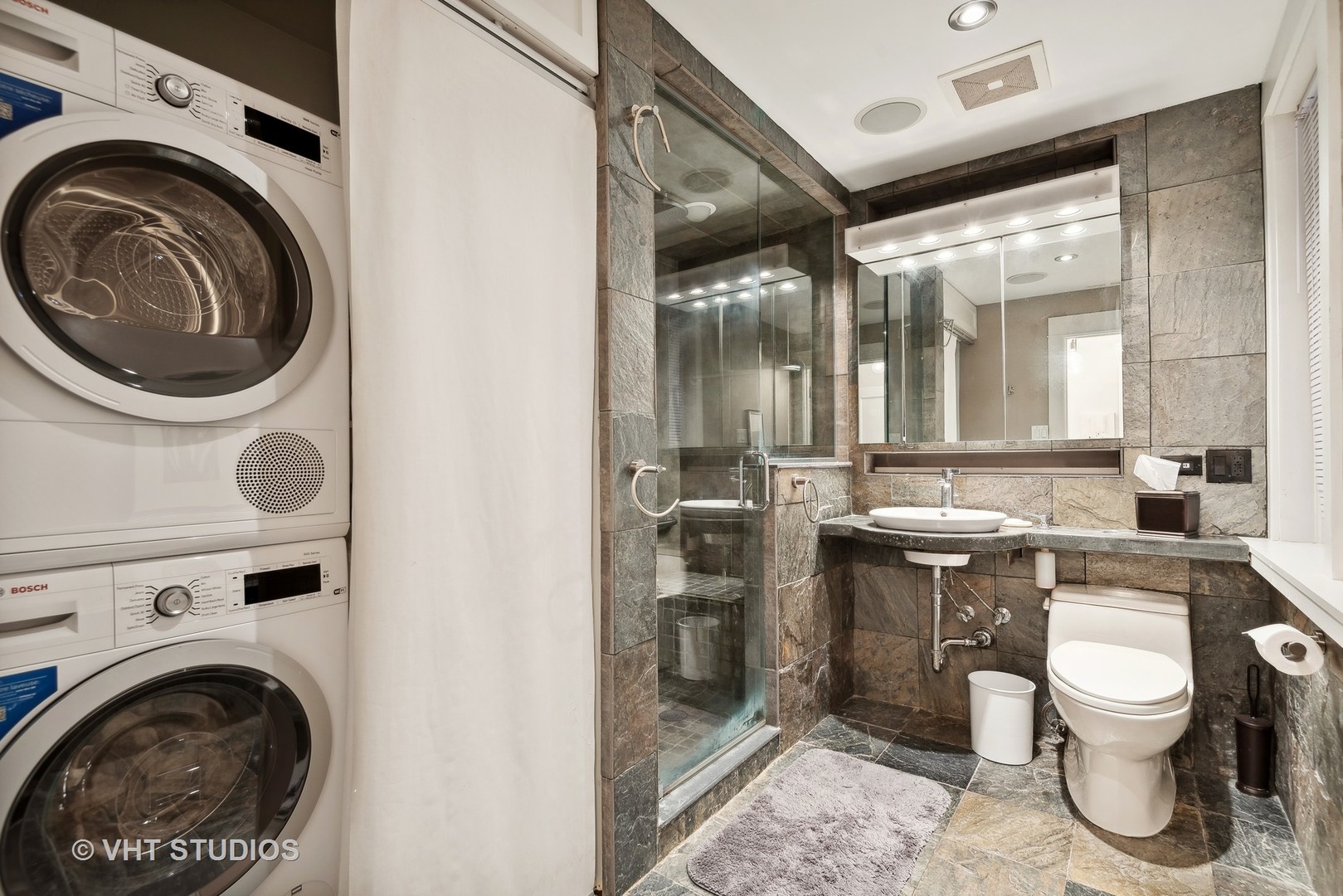 524 Sheridan Road, Unit 2A Evanston, IL 60202 - Photo 17 of 18 a bathroom with a sink mirror vanity and toilet