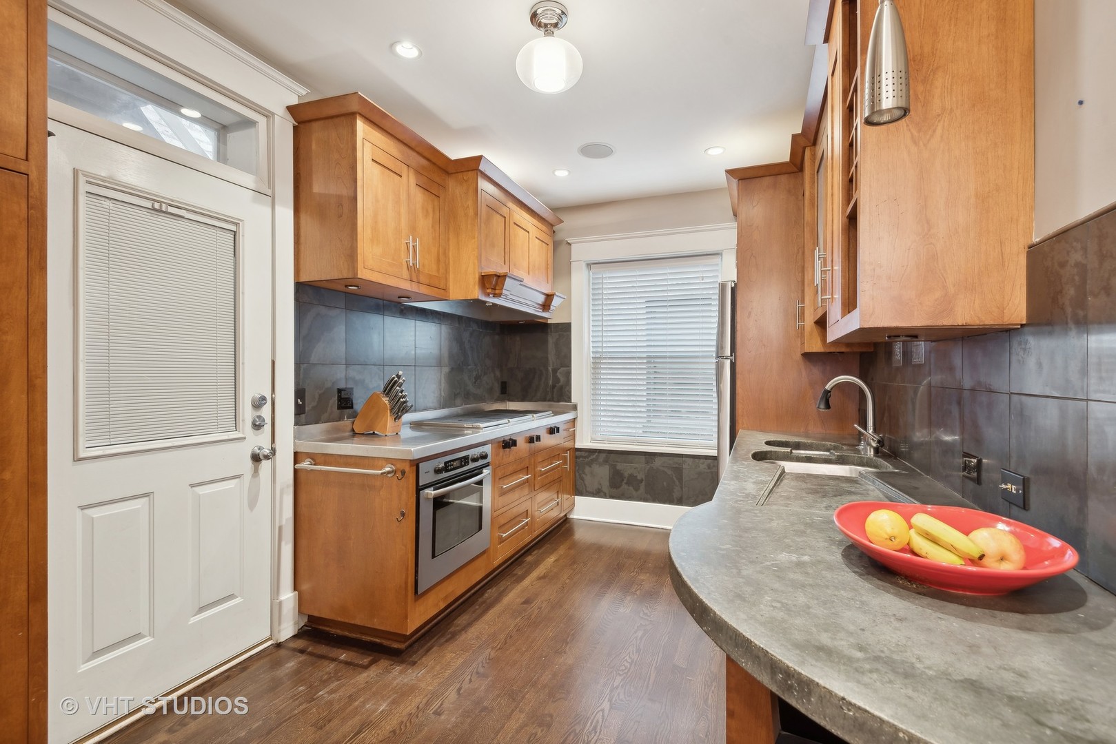 524 Sheridan Road, Unit 2A Evanston, IL 60202 - Photo 8 of 18 a kitchen with stainless steel appliances granite countertop a stove a sink and a refrigerator