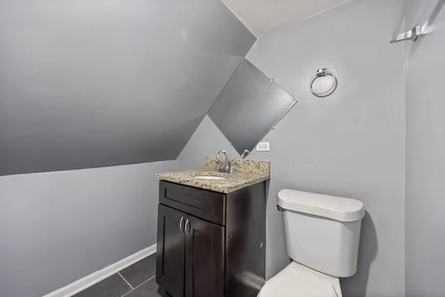 a bathroom with a toilet and a sink