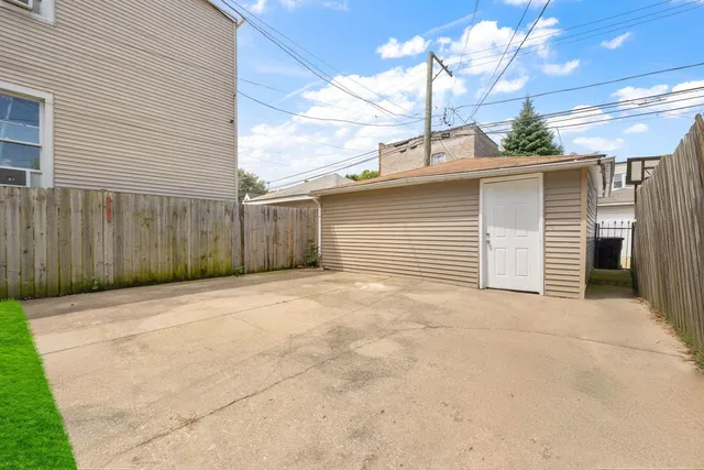 a view of garage and yard