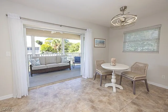 a view of a room with furniture and a window