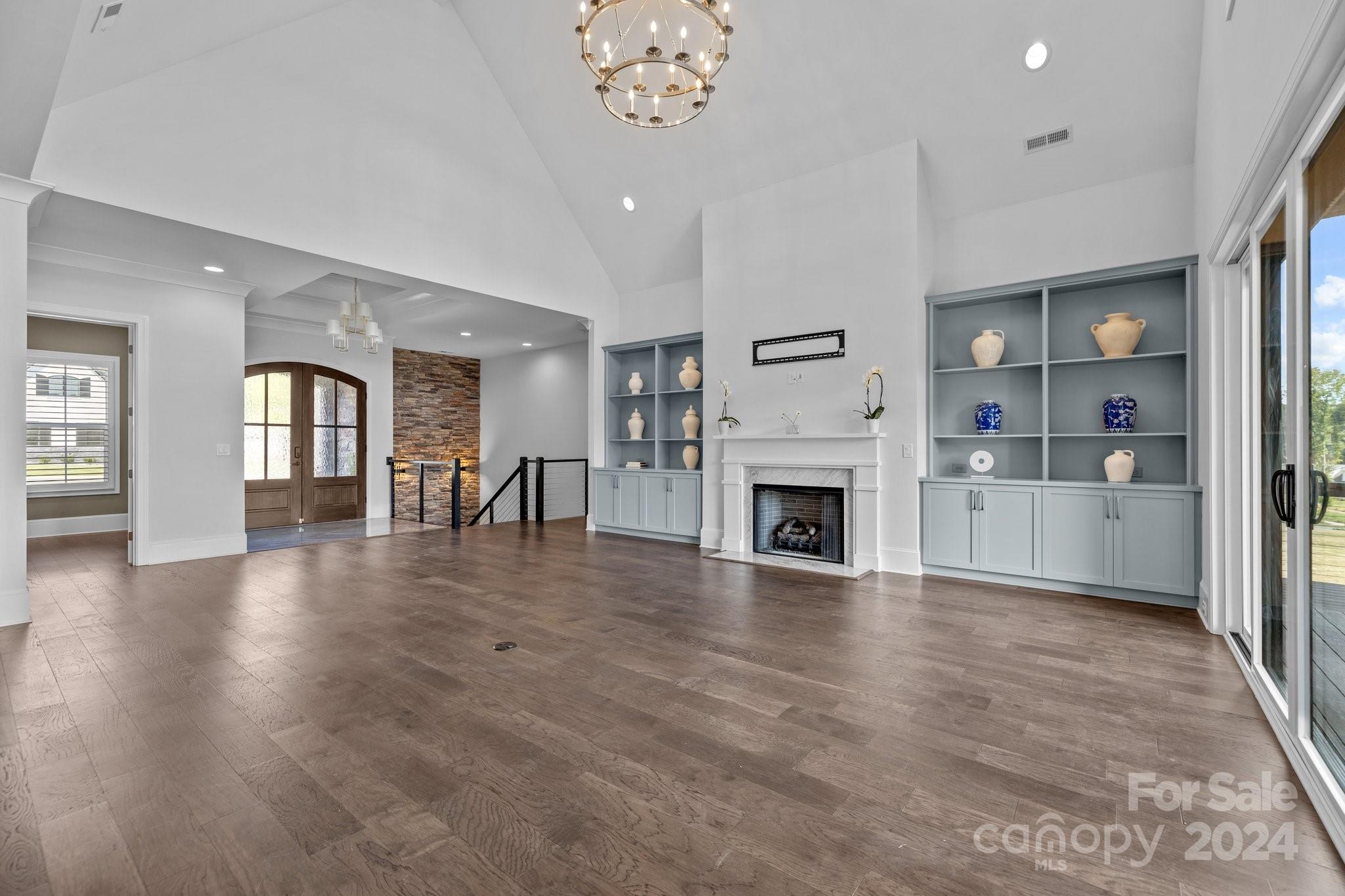 2737 Holbrook Road Fort Mill, SC 29715 - Photo 11 of 46 a view of a livingroom with fireplace wooden floor and a window