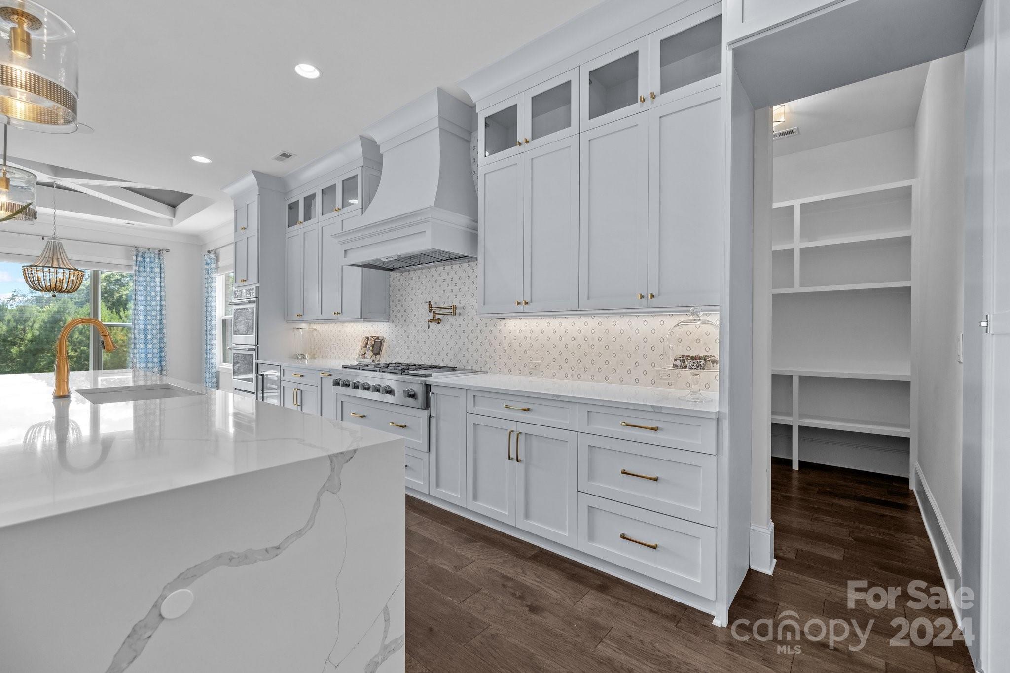 2737 Holbrook Road Fort Mill, SC 29715 - Photo 17 of 46 a kitchen with cabinets appliances and a counter space