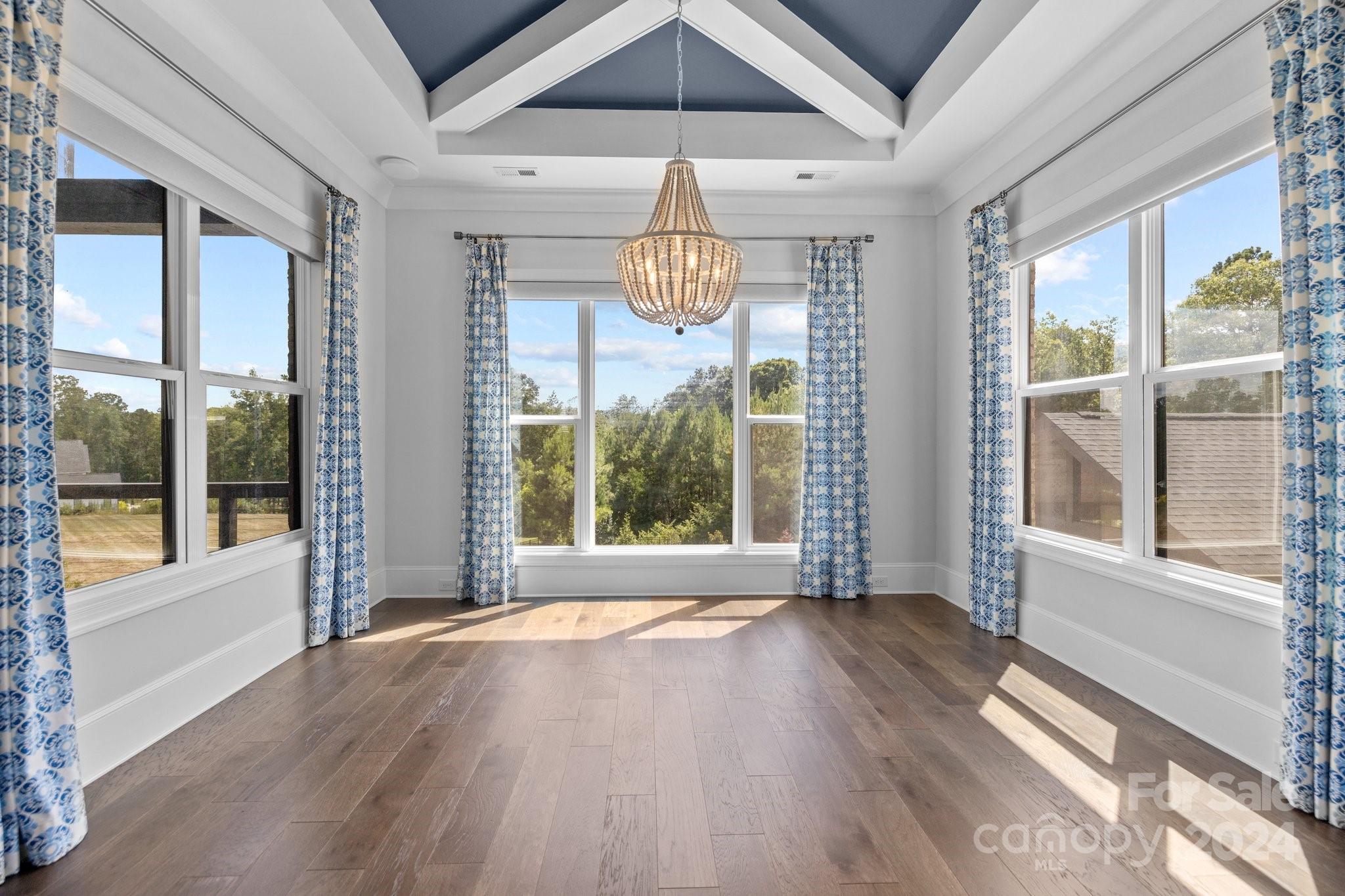 2737 Holbrook Road Fort Mill, SC 29715 - Photo 19 of 46 a view of an empty room with wooden floor and a window