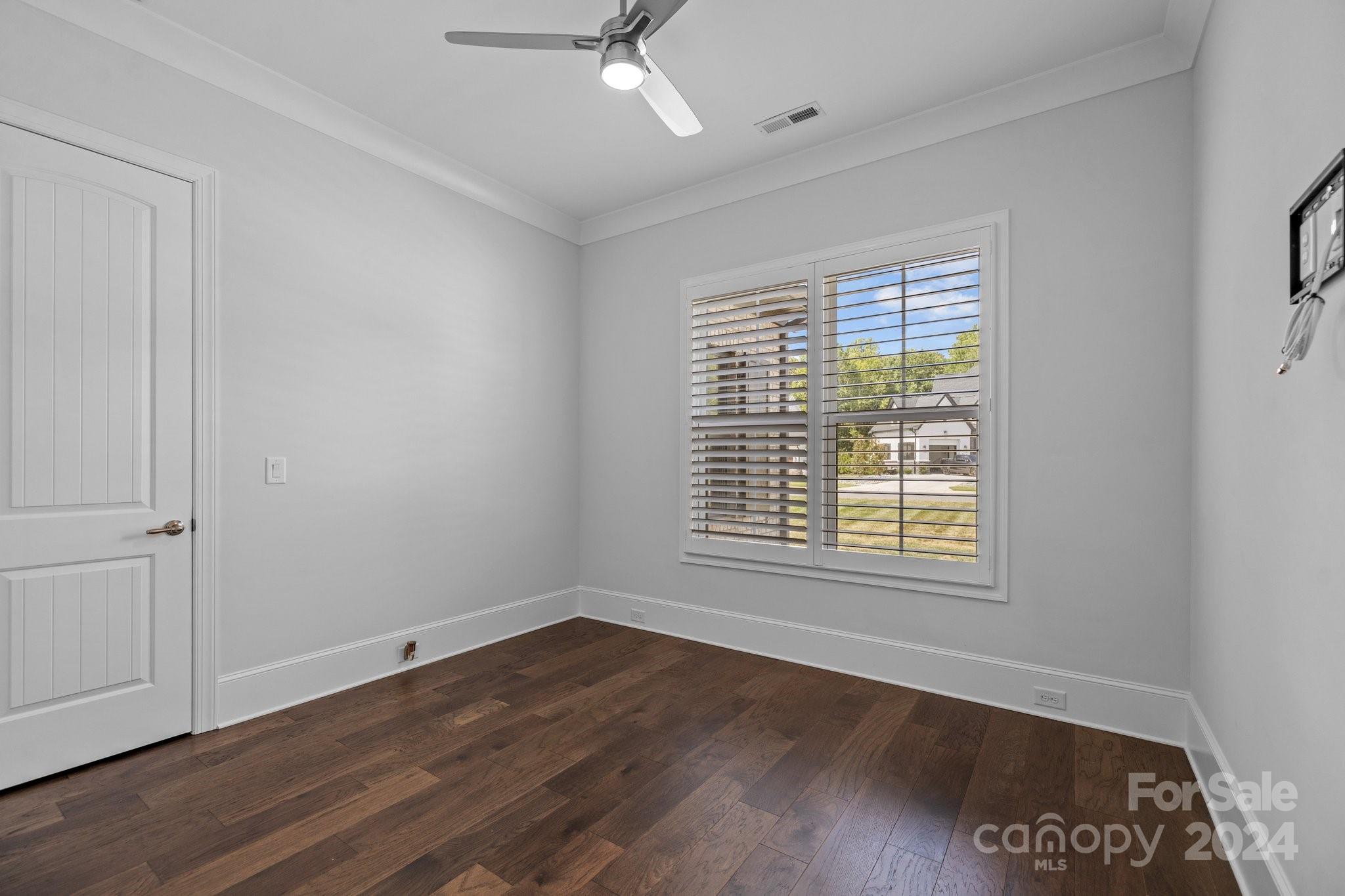 2737 Holbrook Road Fort Mill, SC 29715 - Photo 26 of 46 an empty room with wooden floor and windows
