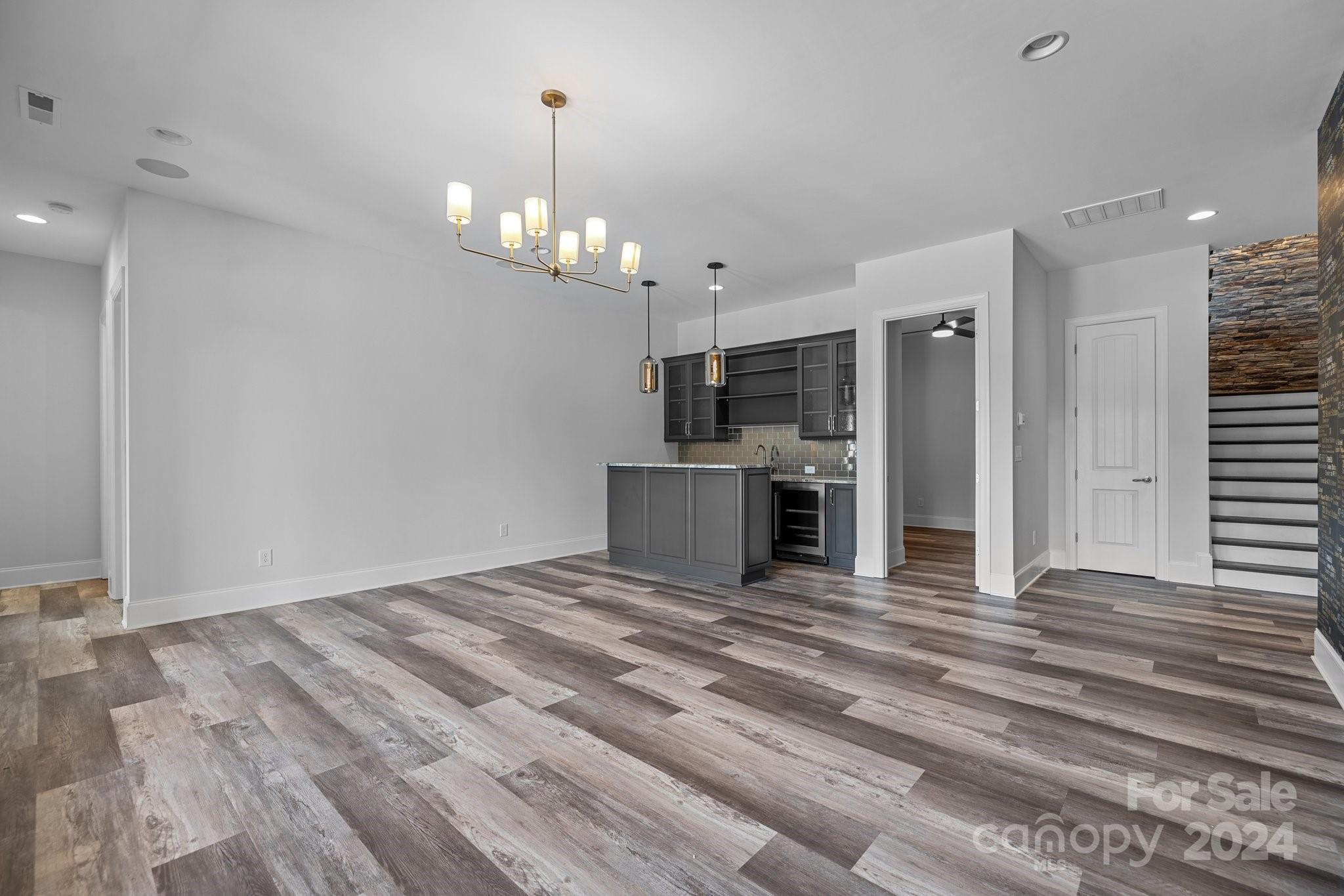 2737 Holbrook Road Fort Mill, SC 29715 - Photo 33 of 46 a view of a kitchen with a stove cabinets and wooden floor