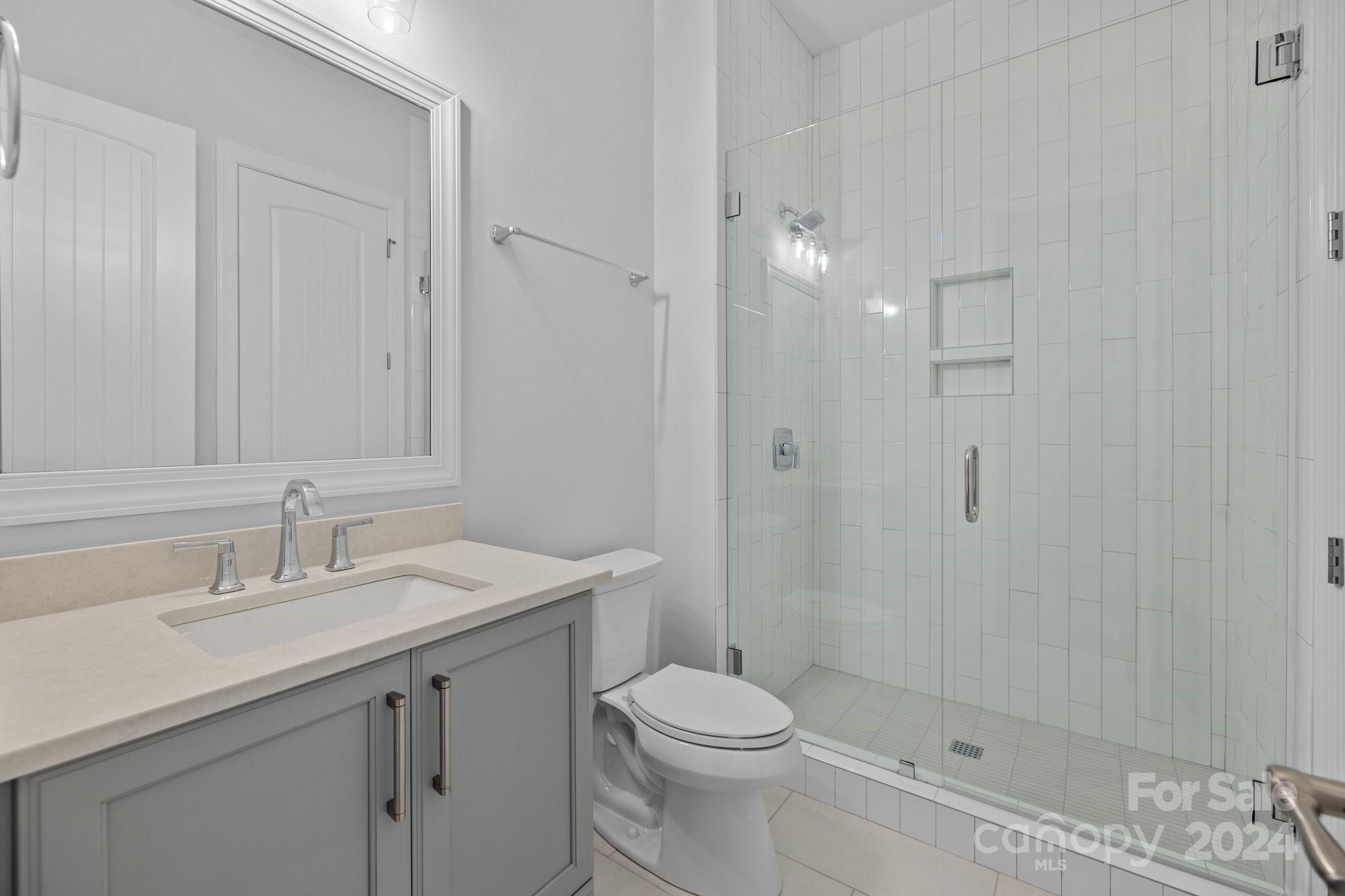 2737 Holbrook Road Fort Mill, SC 29715 - Photo 37 of 46 a bathroom with a sink a toilet and shower