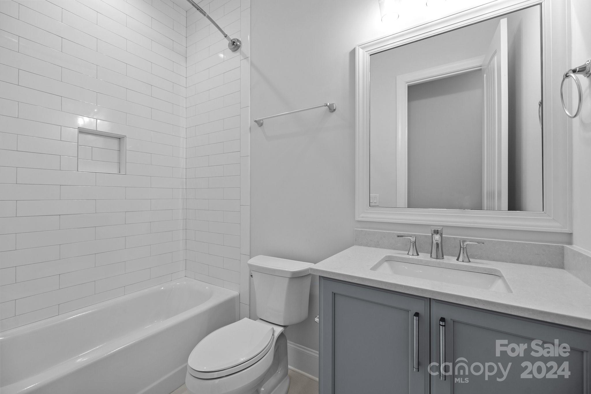 2737 Holbrook Road Fort Mill, SC 29715 - Photo 39 of 46 a bathroom with a granite countertop sink toilet and shower