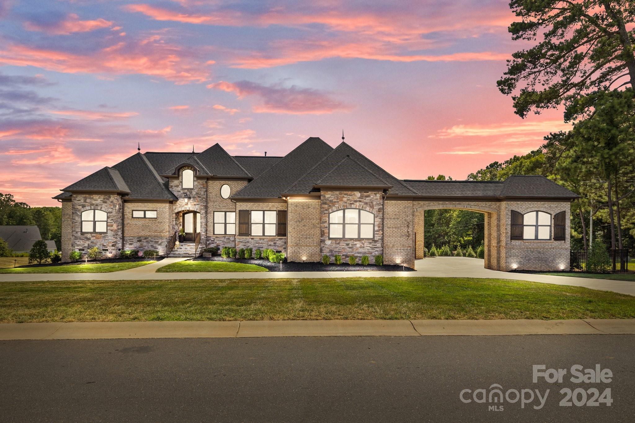 2737 Holbrook Road Fort Mill, SC 29715 - Photo 44 of 46 a front view of a house with a yard and garage