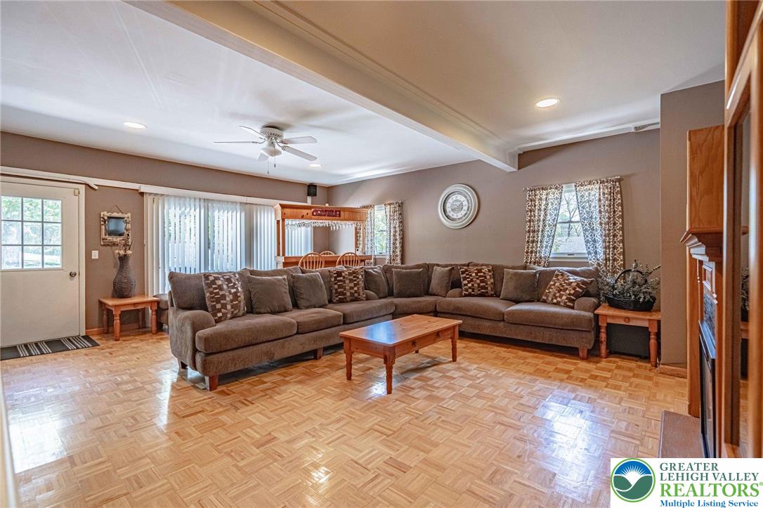 3857 Friedens Road Slatington, PA 18080 - Photo 17 of 75 This expansive living area features parquet flooring and ample space for gatherings.
