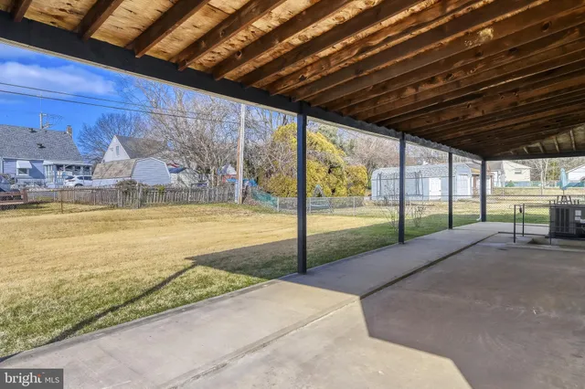 a view of swimming pool with an outdoor seating