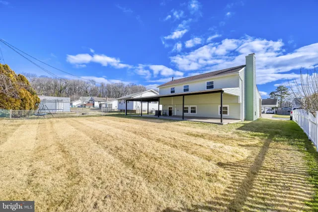 a view of an swimming pool with a yard