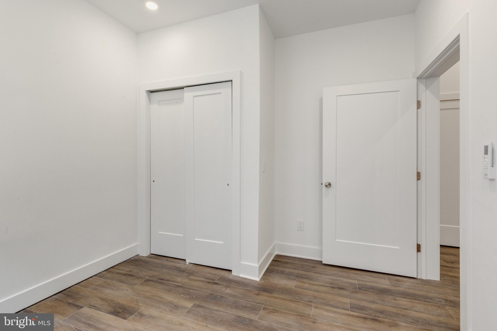 2214 North Front Street, Unit 101 Philadelphia, PA 19133 - Photo 15 of 22 a view of an empty room with wooden floor