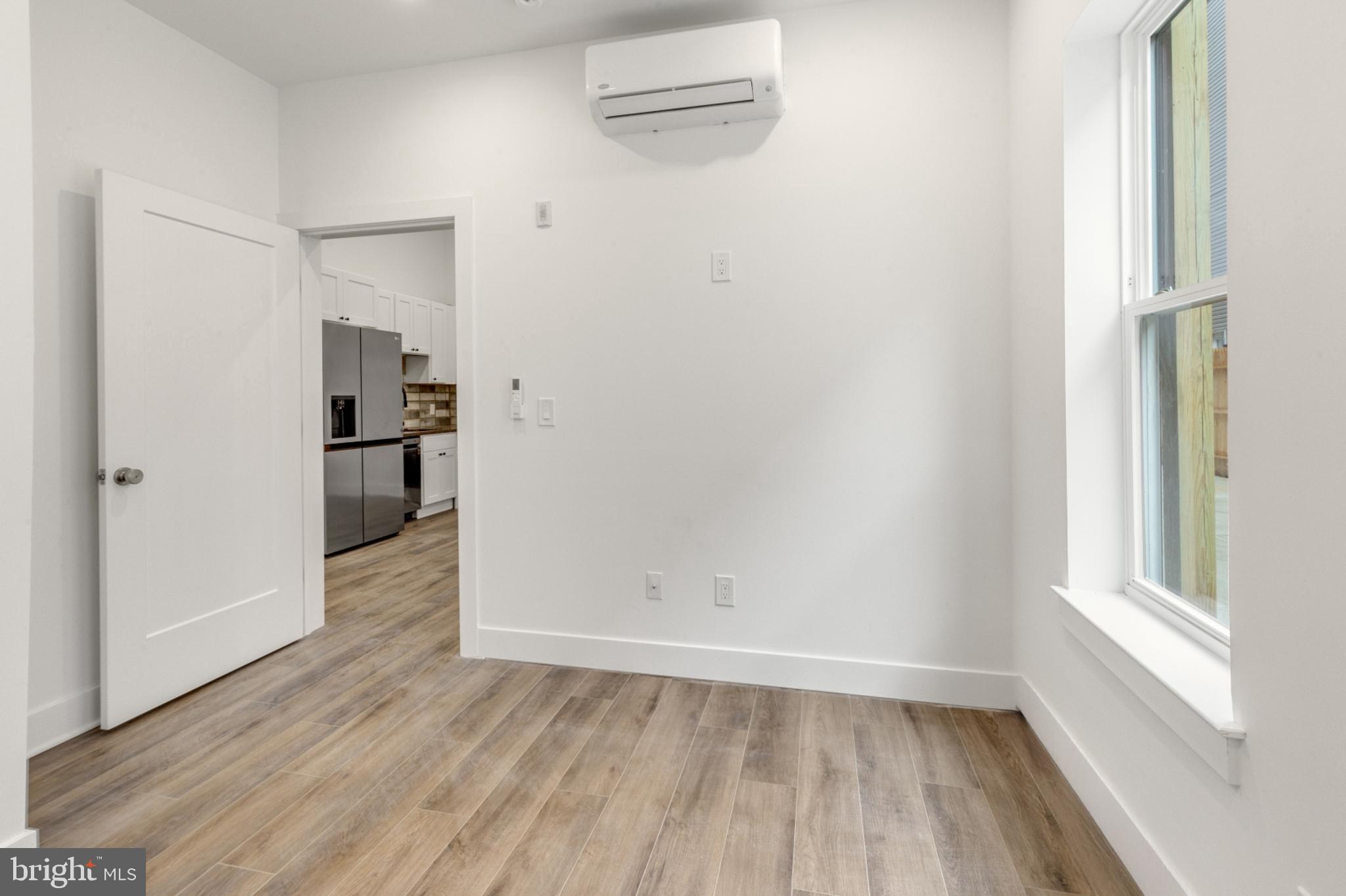 2214 North Front Street, Unit 101 Philadelphia, PA 19133 - Photo 16 of 22 a view of empty room with wooden floor
