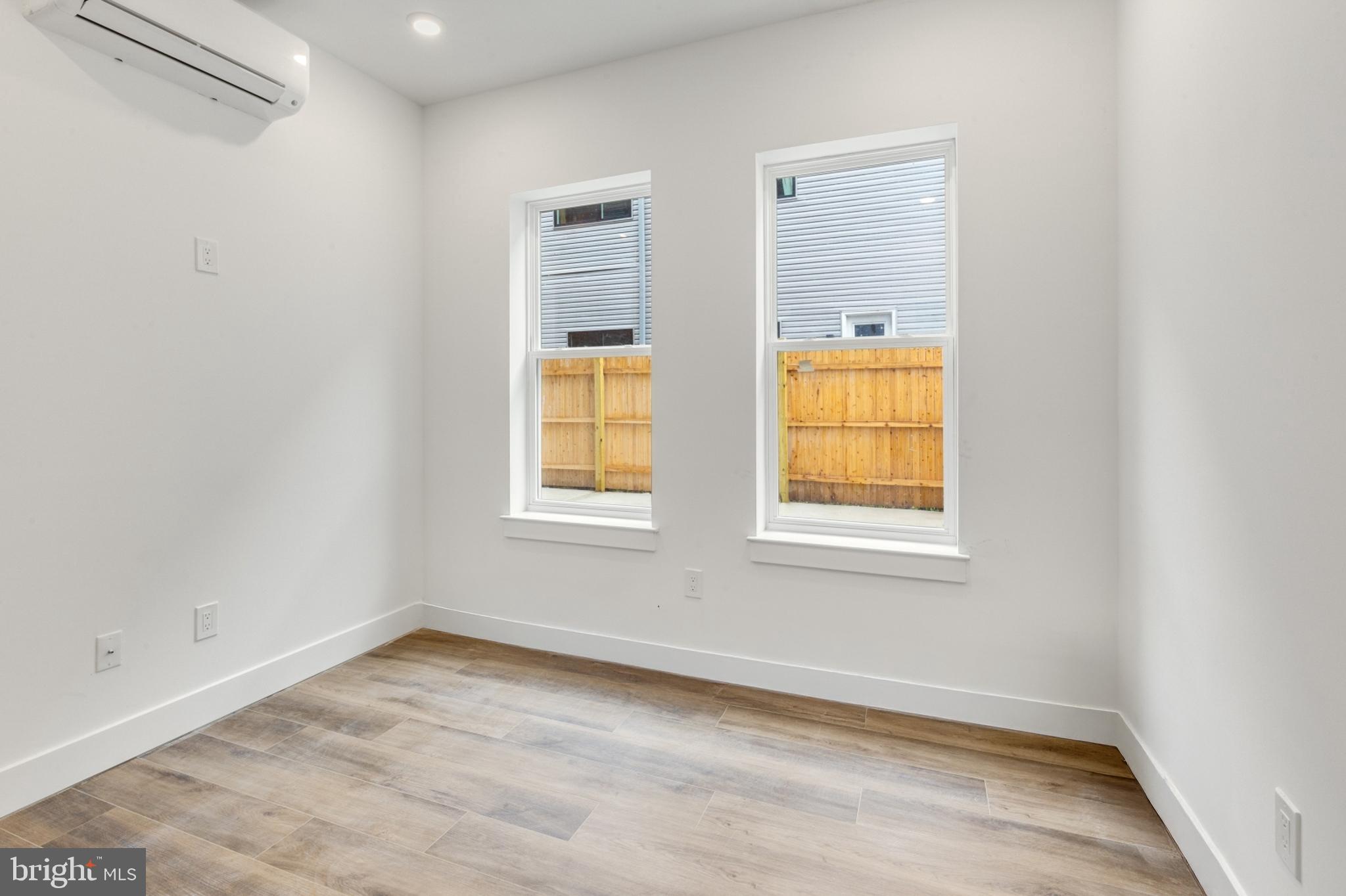 2214 North Front Street, Unit 101 Philadelphia, PA 19133 - Photo 17 of 22 an empty room with windows