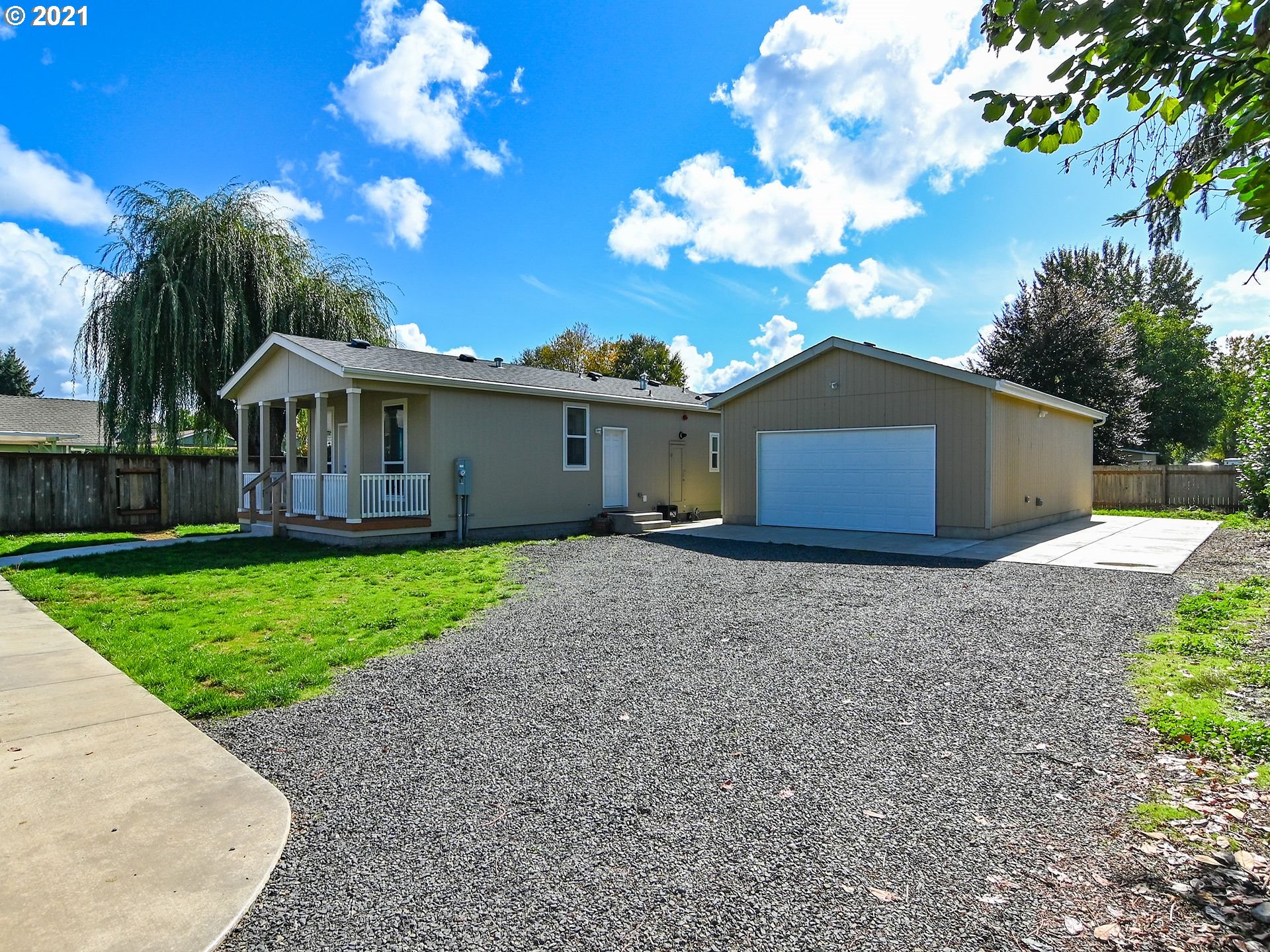 3727 Jasper Road Springfield, OR 97478 - Photo 22 of 32 a view of a house with a yard and large tree