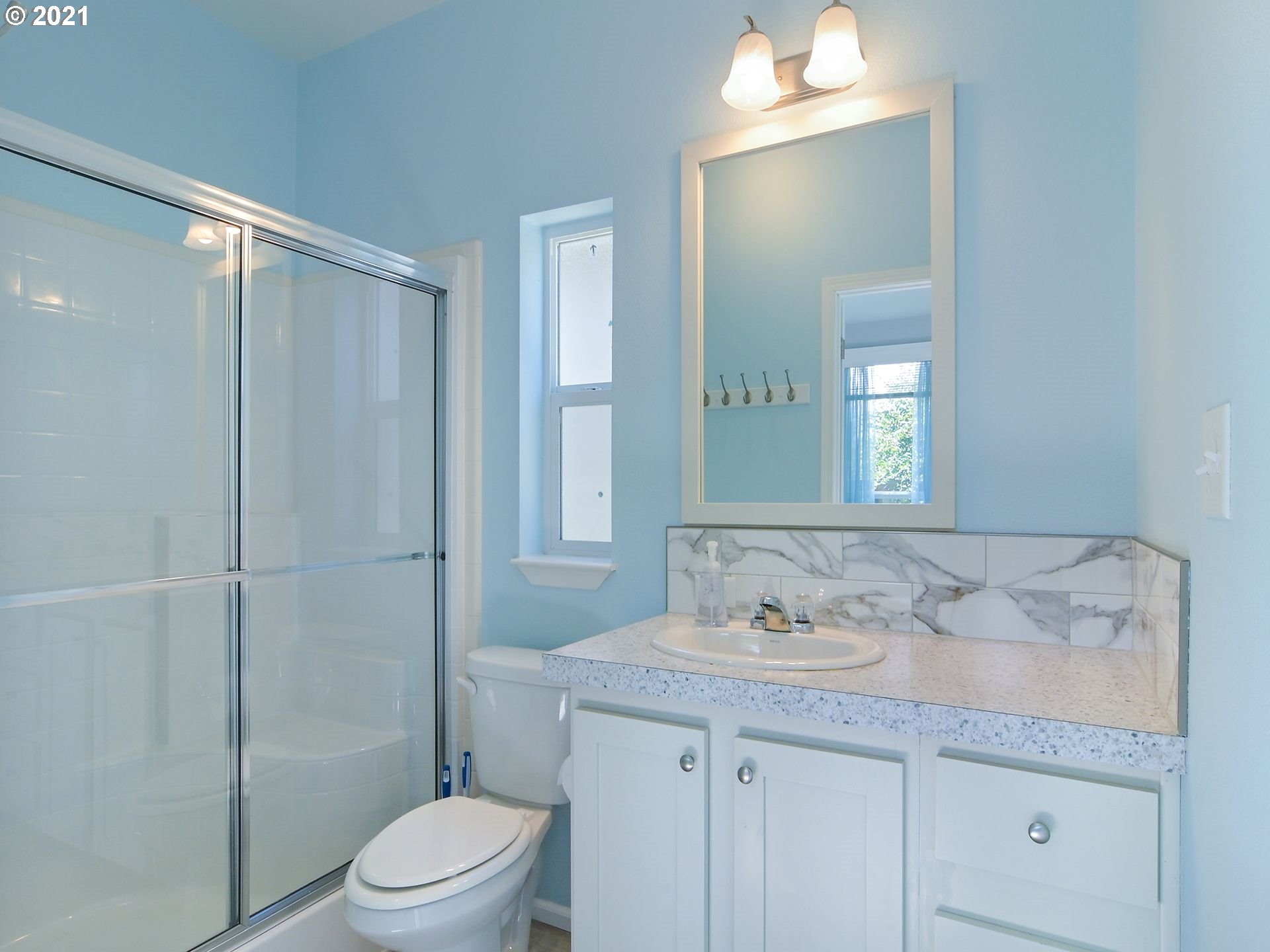 3727 Jasper Road Springfield, OR 97478 - Photo 29 of 32 a bathroom with a granite countertop sink a toilet and shower