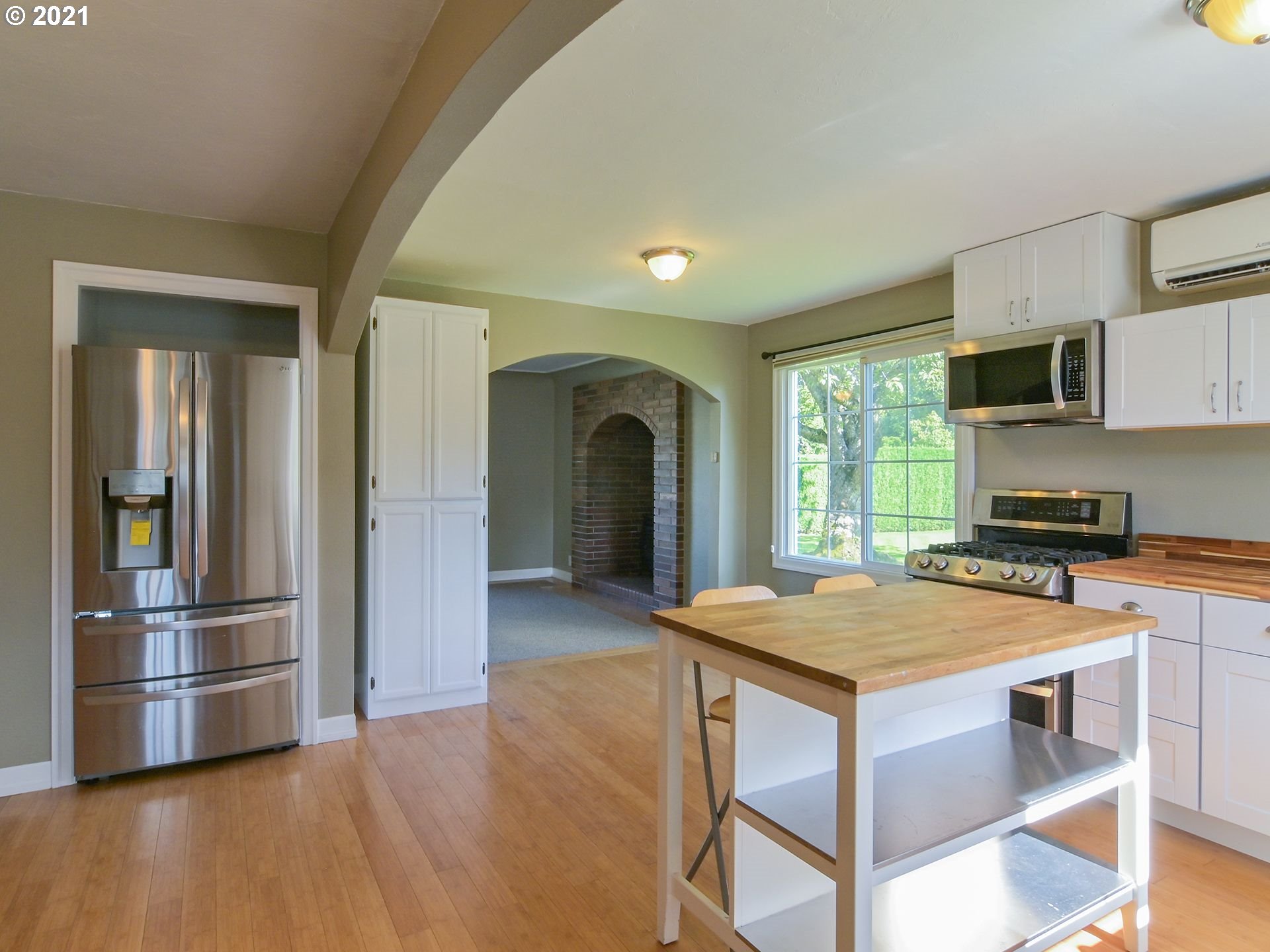 3727 Jasper Road Springfield, OR 97478 - Photo 4 of 32 a kitchen with kitchen island a sink appliances and cabinets