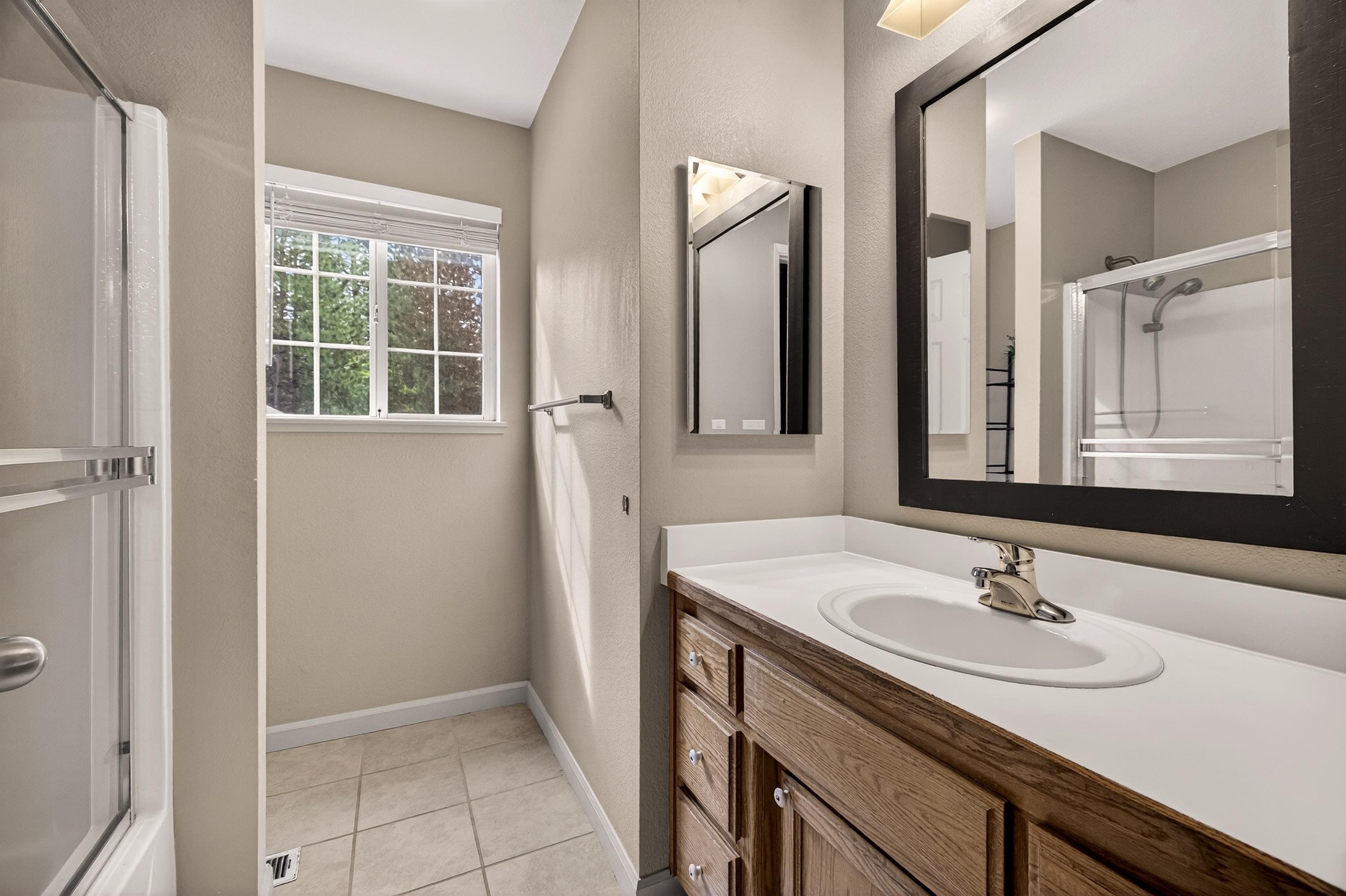811 Golf Club Road Lake Almanor, CA 96137 - Photo 22 of 42 a bathroom with a sink and a mirror