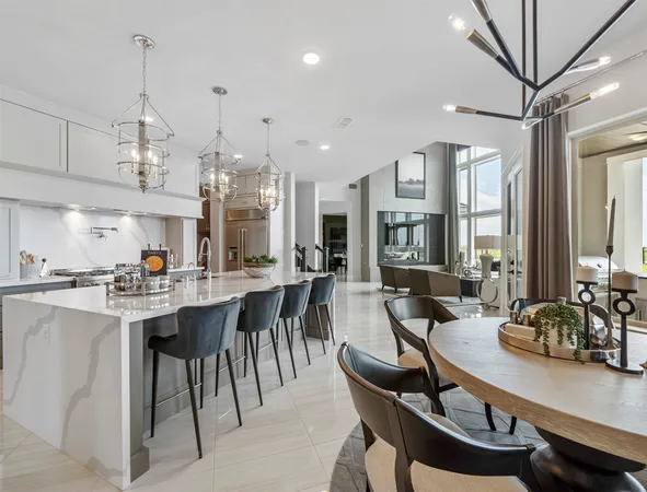 a view of a dining room with furniture large window and chandelier