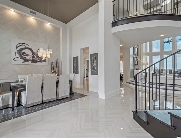a view of a livingroom with furniture and staircase