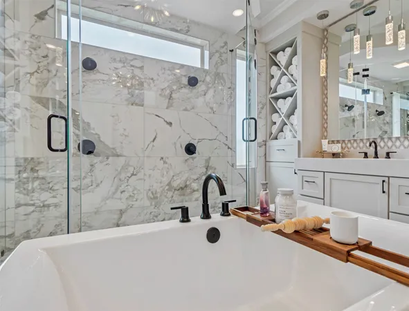 a bathroom with a tub sink and mirror
