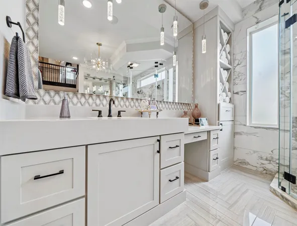 a bathroom with a double vanity sink mirror and