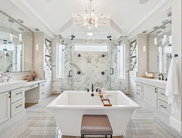 a spacious bathroom with a tub sink a shower and a mirror