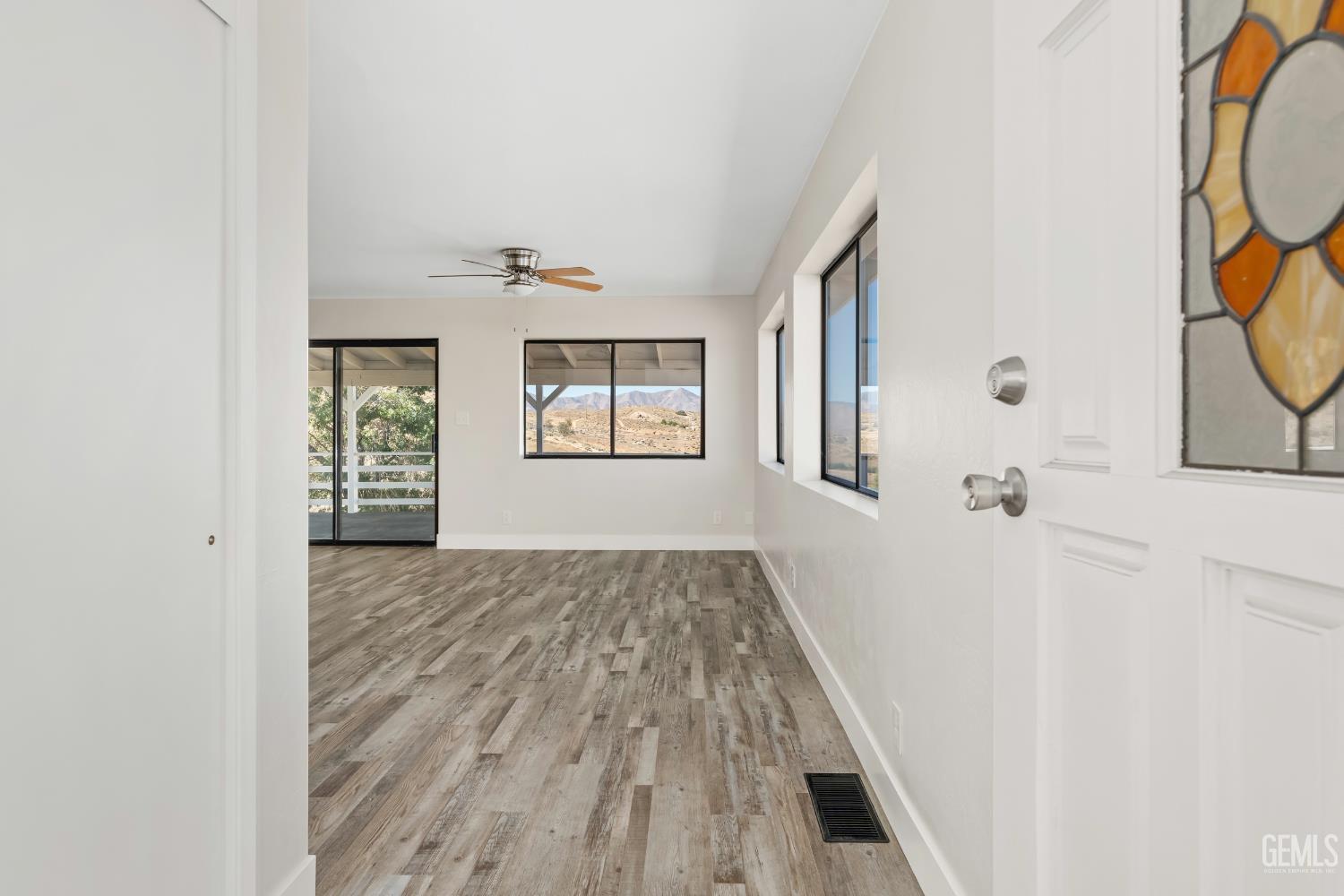 Undisclosed Address Weldon, CA 93283 - Photo 15 of 48 a view of hallway with window and wooden floor