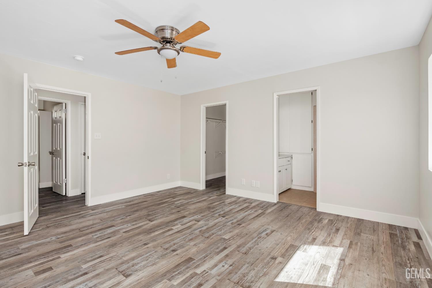 Undisclosed Address Weldon, CA 93283 - Photo 18 of 48 an empty room with wooden floor and ceiling fan