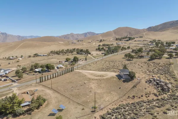 a view of a mountain with a mountain in the background