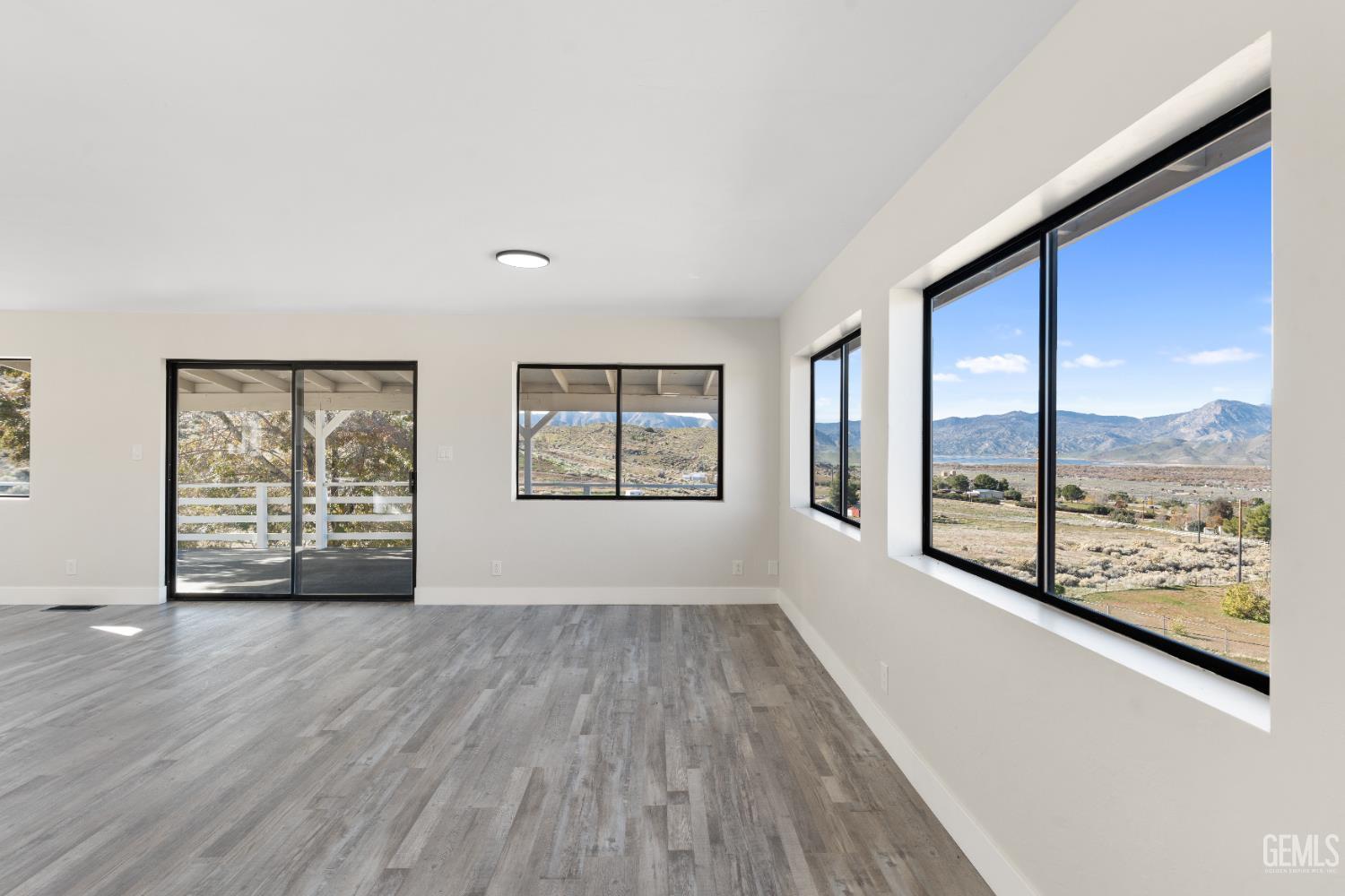Undisclosed Address Weldon, CA 93283 - Photo 35 of 48 wooden floor in an empty room with a window
