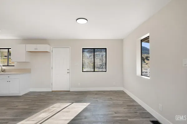 a view of an empty room and window